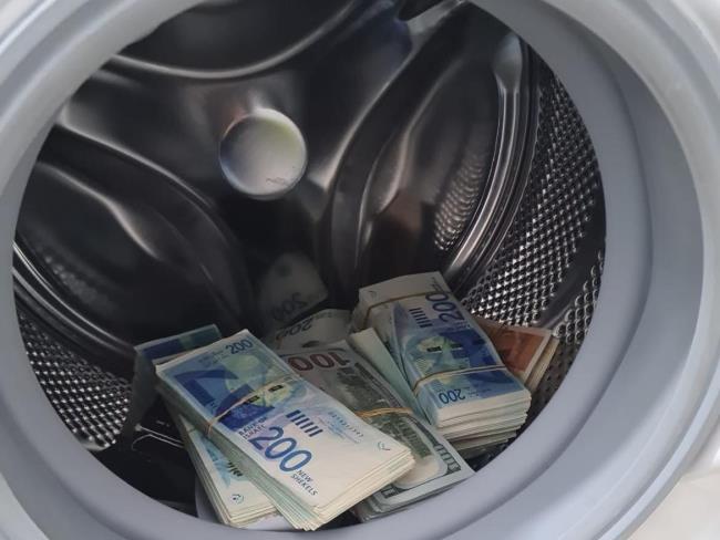 Задержаны подозреваемые в отмывании криптовалюты, прятавшие наличные в стиральной машине